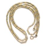A 9ct gold and silver necklace, of modern form, on string strand, with yellow metal clasp stamped 37