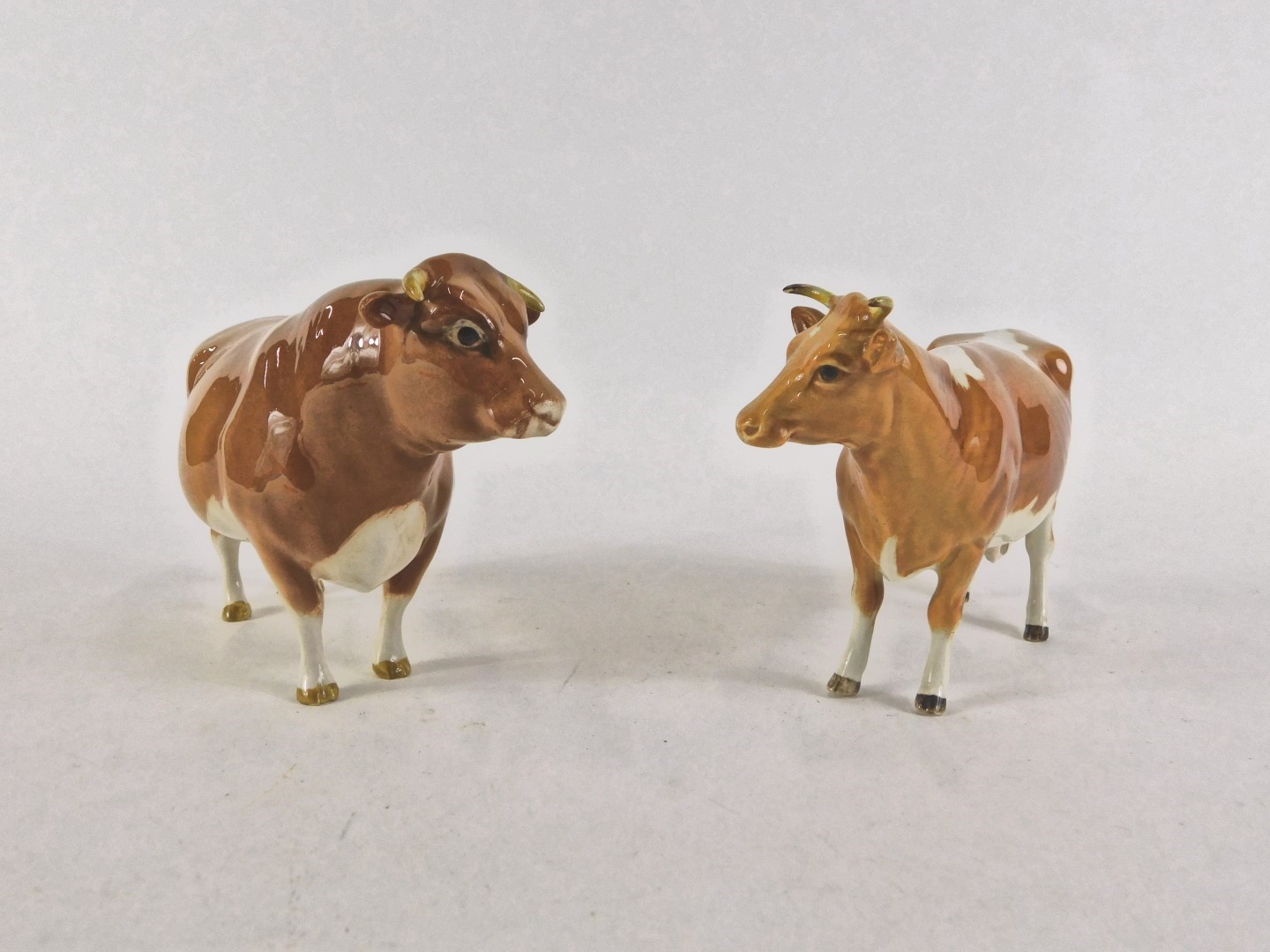 Two Beswick cattle, comprising a CH Sabrina's Sir Richmond 14th Guernsey bull and a cow, 11cm high. - Image 2 of 5