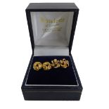 Two pairs of 9ct gold stud earrings, comprising pair of knot design and a pair of flower design with