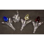 Four Swarovski crystal flowers, comprising red, blue and yellow tulips, 8cm high, and four leaf clov