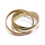 A 9ct gold eternity ring, with three interlinks in white, yellow and rose gold, ring size K½, 4.6g a