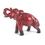 A Royal Doulton Flambe model of an elephant, printed mark in black to underside and signed Noke, 19c