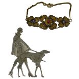 A group of costume jewellery, comprising an Art Deco style female and greyhound stainless steel broo