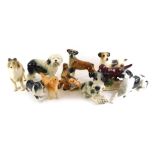 A Beswick matt glazed ceramic figure of a Golden Retriever and other ceramic dogs.
