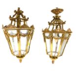A pair of early 20thC brass lanterns, each of octagonal form with etched glass panels, with floral s