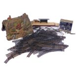 A quantity of OO gauge track, together with a Powermaster variable transformer unit, resin tunnel, e
