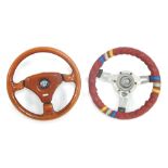 Two steering wheels, comprising an Alfa Romeo Momo, and a Mountney Wheels steering wheel. (2)