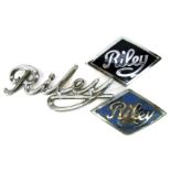Three Riley car badges, comprising two Riley and enamel diamond shaped badges, 7cm wide, and a chrom