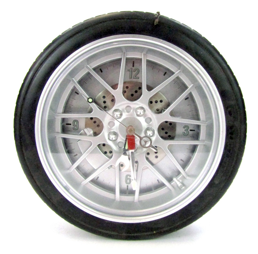 A car tyre wall clock, 34cm diameter.