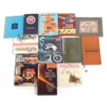 A group of automobile books and accessories, including The Wonder Book of Machinery, Fiat by Michael