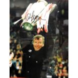 A signed photo print of Alex Ferguson, holding the European Cup aloft, signed, framed and glazed, 46