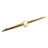 An opal bar brooch, the oval cabochon opal flanked by two tiny diamonds, in a yellow metal setting,