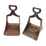 A pair of Spanish steel stirrups, with stylised flower head decoration and pierced bases. 20.5cm hig