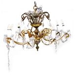 A mid century brass and cut glass two tier eight branch candelabra, with prismatic and brilliant gla