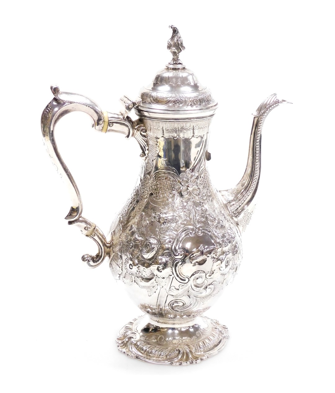 An antique silver coffee pot, of baluster form, embossed with flowers and engraved with leaves, vaca
