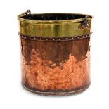 A Victorian copper and brass coal bucket, with swing handle and studded decoration, 34cm high