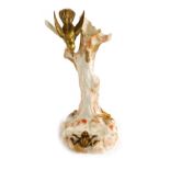 A late 19thC Royal Worcester porcelain spill vase, circa 1879, of tree form, modelled with a bird on