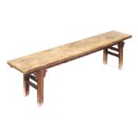 A Chinese hardwood bench, raised on straight legs, 177cm wide.
