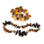 A rough hewn amber and silver necklace, together with a rough hewn and silver bracelet. (2)