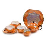 An early 20thC Atlas Czechoslovakia porcelain orange and pearl lustre tete a tete, comprising biscui