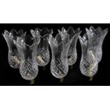 Seven cut glass storm lantern shades, with brass mounts, 23cm high.
