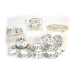 A Minton porcelain Haddon Hall pattern part tea service, comprising teapot, sucrier, sugar bowl, cre
