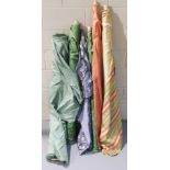 Six rolls of assorted upholstery fabrics, various colours, including striped, floral and fleur de ly