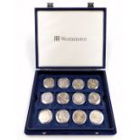 A group of silver commemorative five pound coins, including Queen Elizabeth The Queen Mother's 100th
