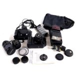 A Canon T90 camera, with 35mm lens, Canon EOS5 camera, further lenses and a flash.