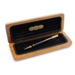 A Parker Duofold propelling pencil for Aquascutum, with black casing, in a cherrywood Aquascutum box