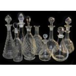 A group of 19thC cut and pressed glass decanters, and stoppers, (9)