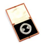 An Edwardian diamond brooch, of circular Celtic form, in white metal, box marked for Hennell of Lond