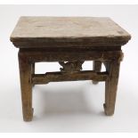 A 19thC Chinese provincial stool, with moulded border raised on four slightly splayed, stylised legs