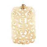 A Chinese white jade pendant, with pierced and scrolling detailing, on a yellow metal mount, 7cm x4.