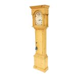 A replica effect pine longcase clock, with break arch dial, the door opening to reveal two shelves,