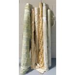 Six rolls of predominately green and gold upholstery fabric, various patterns including The Gainsbor