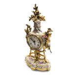 A Louis XIV style porcelain mantel clock, circular enamel dial bearing Roman and Arabic numerals, ei
