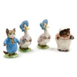 Two Beswick Beatrix Potter figures modelled as Jemima Puddle-Duck, and another of Tom Kitten, gold b