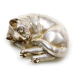 An Elizabeth II silver figure of a cat, in sleeping pose, Garrard and Company Limited, London 1998,