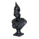 A late Victorian patinated spelter bust of Apollo, with ram's head helmet, raised on a plain socle s