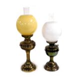 A brass oil lamp, with chimney and yellow glass shade, 58cm high, and a Duplex brass oil lamp, with