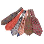 Six silk cravats, variously decorated in Paisley pattern, flowers, etc.