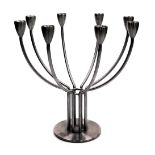 A K&M Hagberg brushed stainless steel eight branch candelabrum, bears label, 33cm wide.