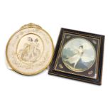 A Victorian gilt metal oval frame, with easel back and delicate ribbon and flower pierced crest, wit