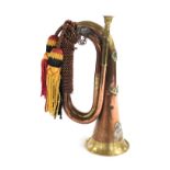 A copper and brass military bugle, with the West Yorkshire Regiment cipher to the front, stamped to