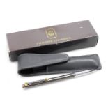 A Philippe Charriol ballpoint pen, with grey leather pouch, boxed.