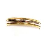 An 18ct two coloured gold wedding band, size R, 2.9g.