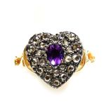 An amethyst and diamond ring, in a heart shaped setting, in yellow metal, size N, 3.1g all in.