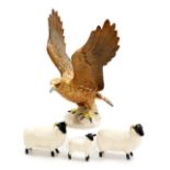 A Beswick pottery figure of a Golden Eagle no. 2062, (AF), together with two Beswick sheep and a lam