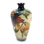 A Moorcroft pottery Anna Lily pattern vase, of shouldered tapering form, painted and impressed marks